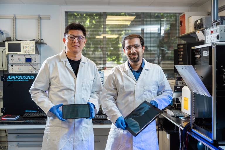 associate_professor_mojtaba_abdi-jalebi_and_phd_candidate_siming_huang_with_panels_of_their_solar_cells_optimised_for_indoor_light._credit_ucl_james_tye_0