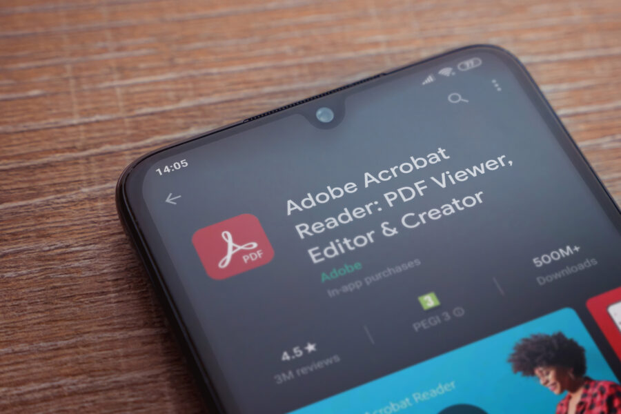 Adobe Acrobat Reader app play store page on the display of a bla
