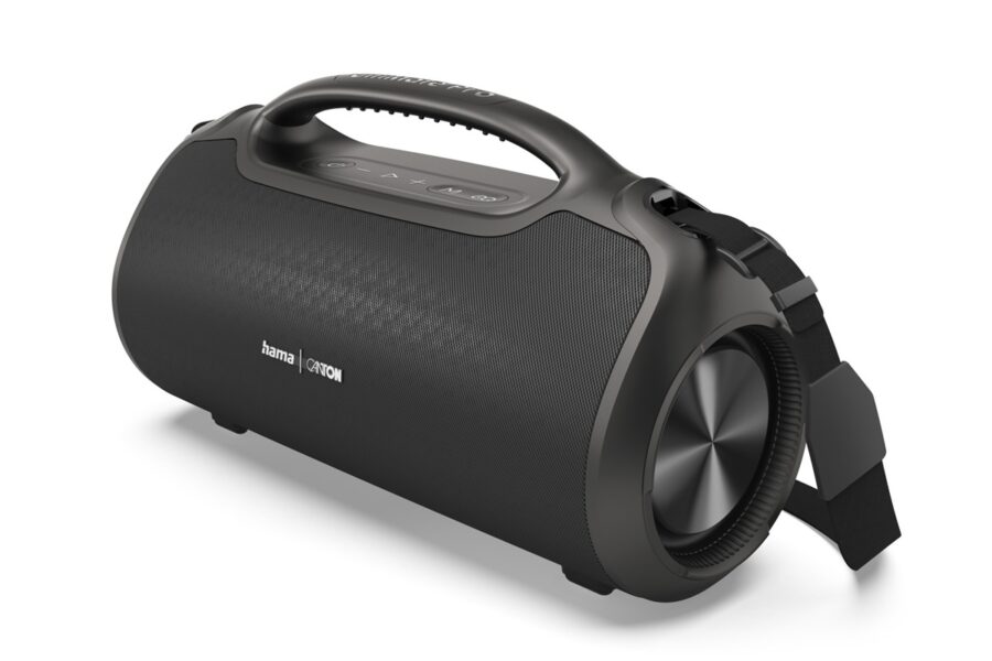 Black portable Bluetooth speaker with a top handle, cylindrical body, and fabric grille; strap attached on the side.