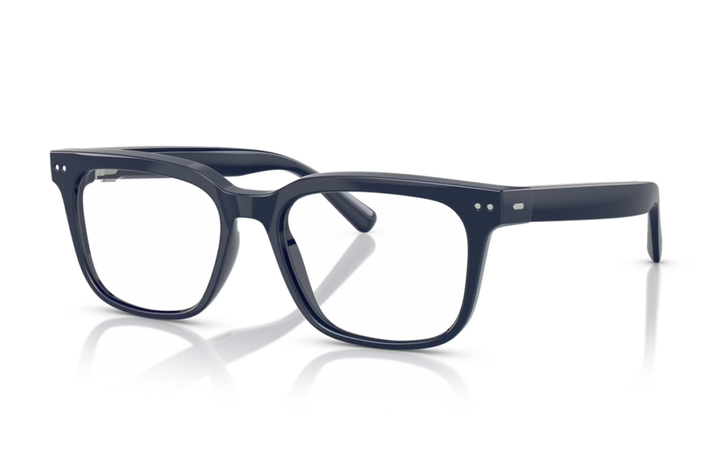 Navy blue rectangular eyeglasses with clear lenses resting on a reflective surface.