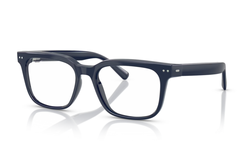 Navy blue rectangular eyeglasses with clear lenses resting on a reflective surface.
