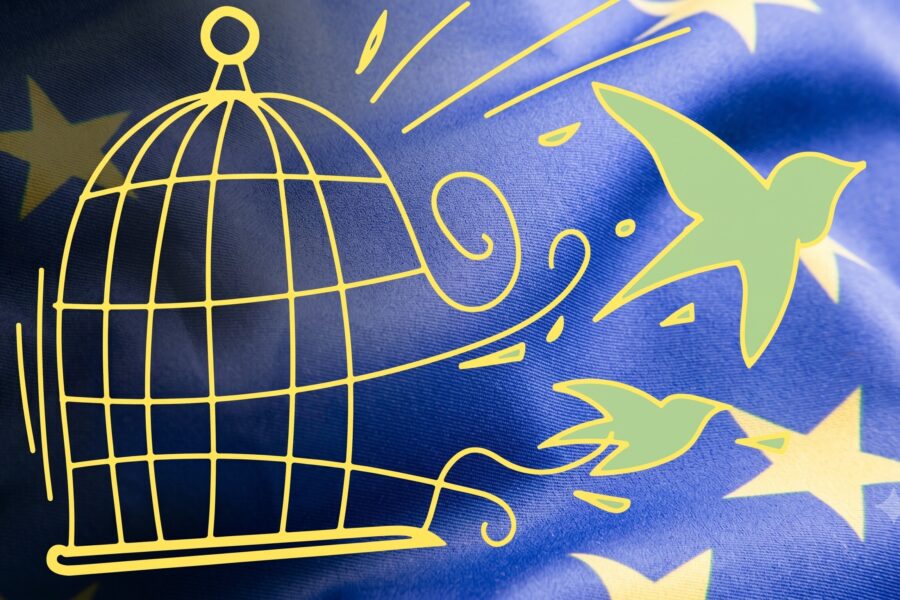 Yellow line drawing of an open birdcage with a bird escaping to the right on a blue background with yellow stars, symbolizing freedom.