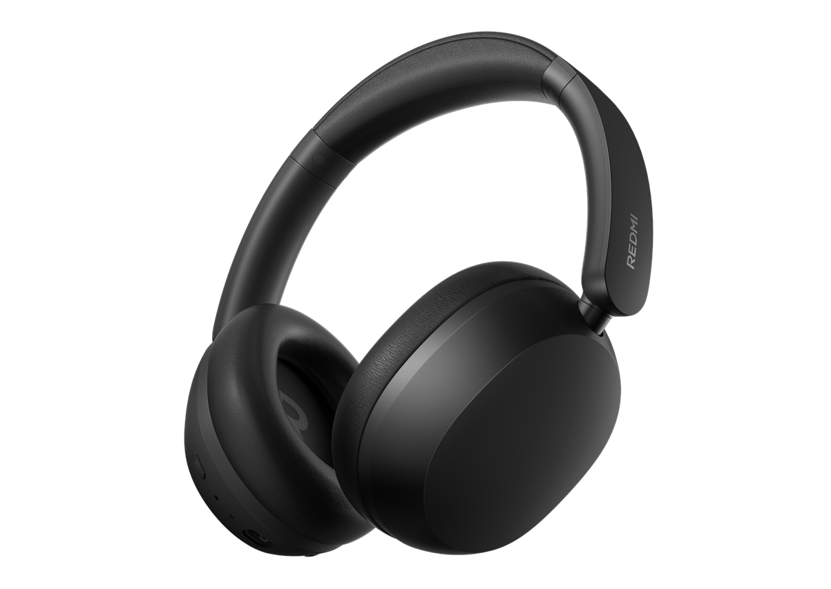 Black over-ear headphones with padded headband and Redmi branding on the earcup, shown at an angle