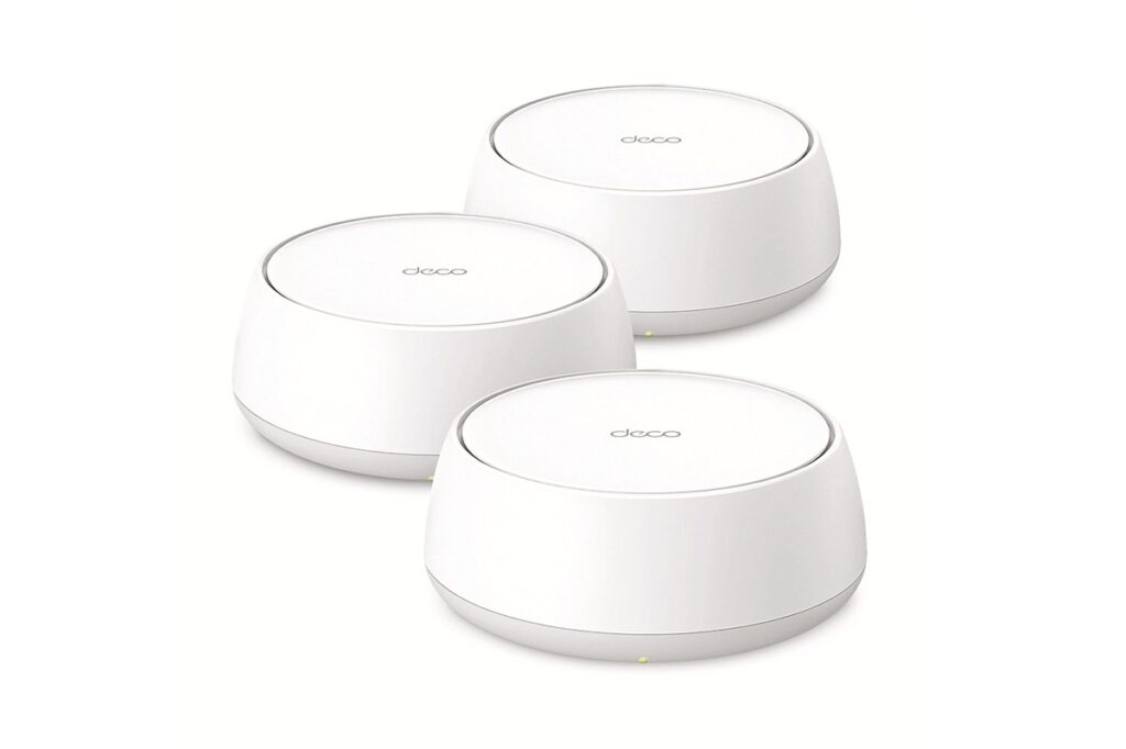 Three white circular Deco mesh Wi‑Fi nodes arranged in a cluster for home internet coverage.