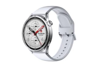 Silver smartwatch with a white silicone band and circular multi-dial face on a black background (informational product image).