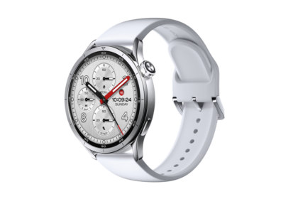 Silver smartwatch with a white silicone band and circular multi-dial face on a black background (informational product image).