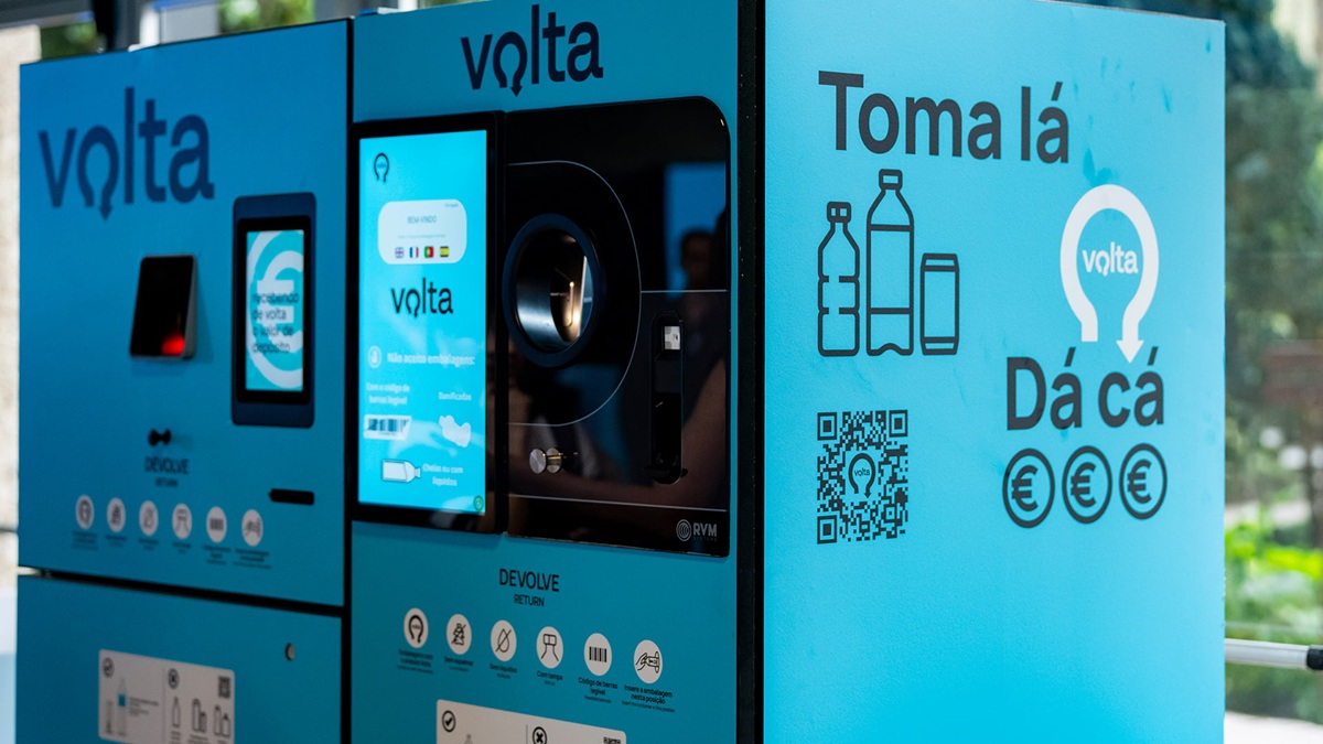 Public bottle-return kiosk with blue Volta branding, touch screen, and a QR code