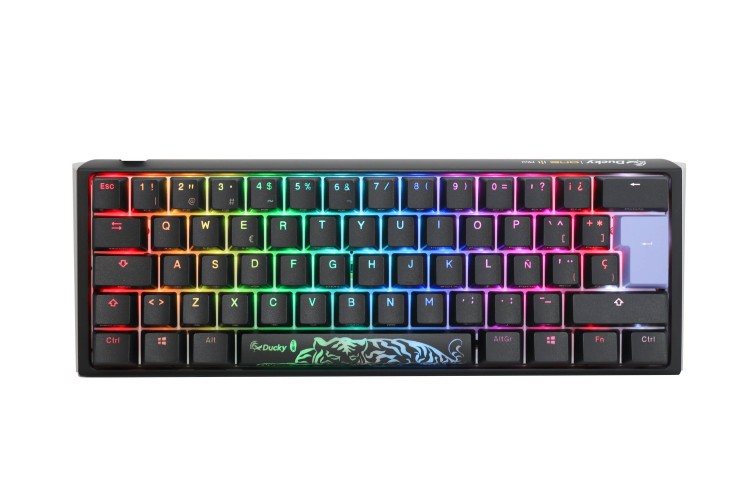 Compact rainbow RGB mechanical keyboard with teal dragon graphic on spacebar area.",