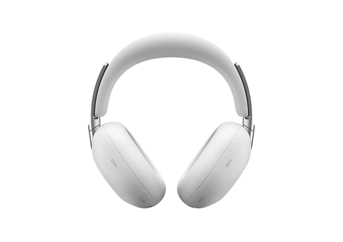 White over-ear headphones with a cushioned headband, isolated on a black background.