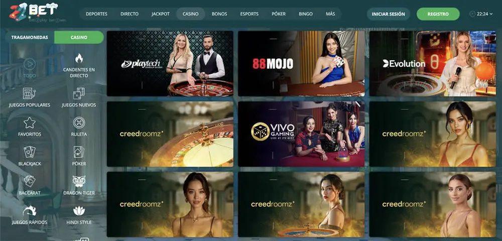 Teal-toned casino homepage with a left menu and a grid of game thumbnails featuring Playtech, Mojo, and Evolution logos.