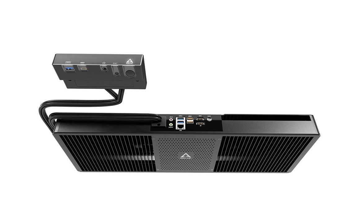 Black mini PC with a large ventilated front, connected to a small external I/O box via two cables.