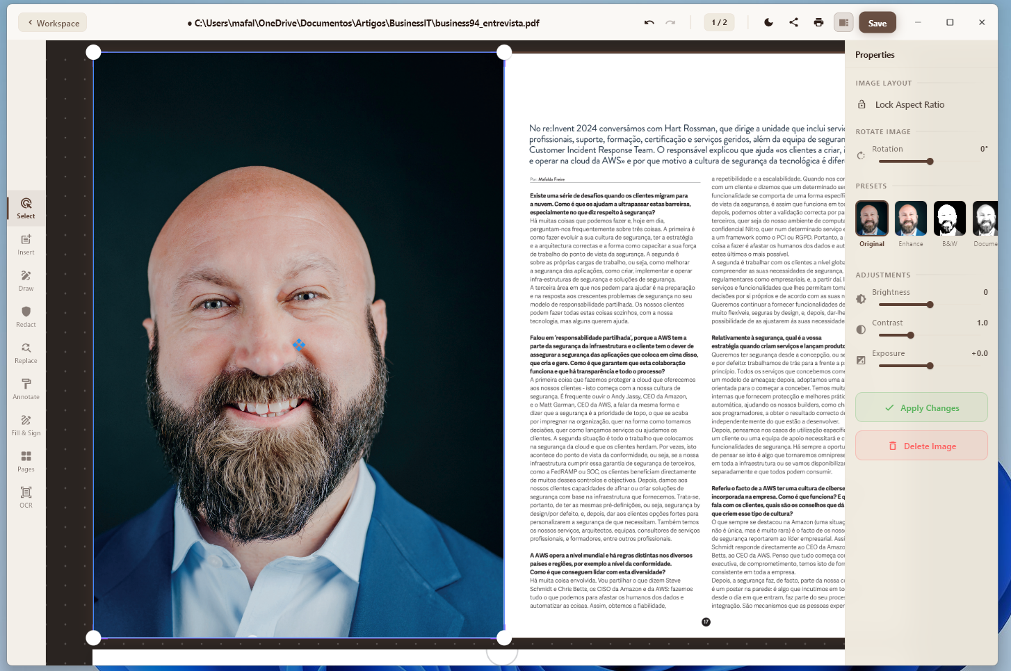 Portrait of a smiling bald man with a beard in a blue suit on the left, paired with a dense two-page PDF article on the right.