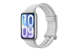 White smartwatch with rounded display showing 10:09, silver case, white band.