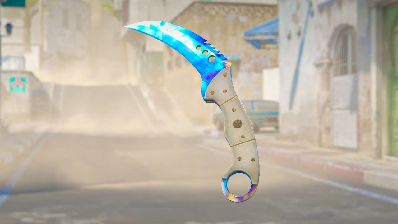 Curved blue-edged karambit knife hovering over a dusty urban street scene.
