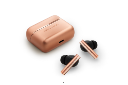 Rose-gold wireless earbuds with a matching rose-gold charging case; brand Bang & Olufsen visible on both pieces.