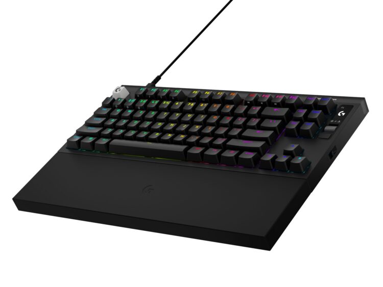 High_Resolution_PNG-PRO X2 Rapid Black 3QTR R | PCGuia Angled view of a black wired gaming keyboard with rainbow RGB backlighting and a thick USB-style cable plugged in at the top left corner.
