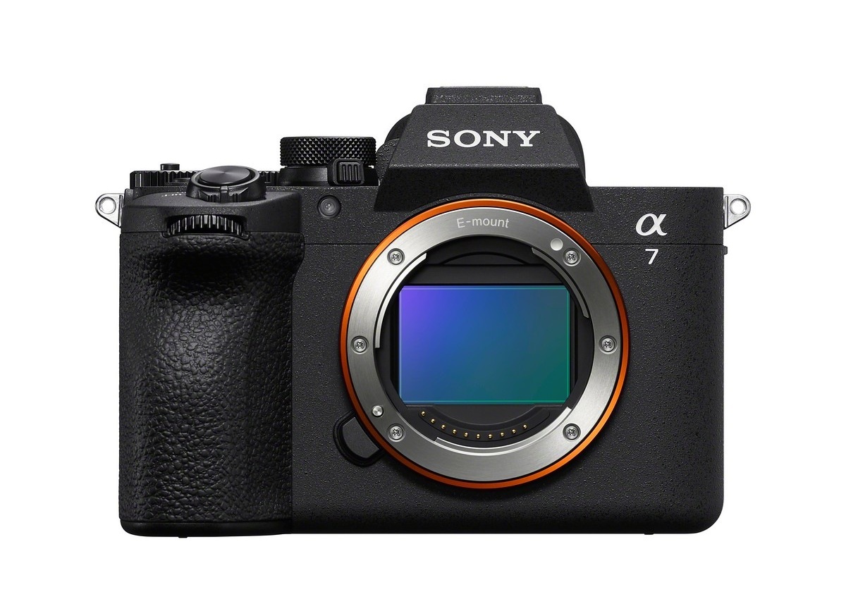 Front view of a Sony Alpha 7 mirrorless camera body with exposed E-mount and orange ring, black textured grip on the left.