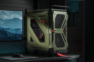 Olive-green Corsair PC tower with protective frame on a desk beside a monitor displaying a sci-fi HUD screenshot.