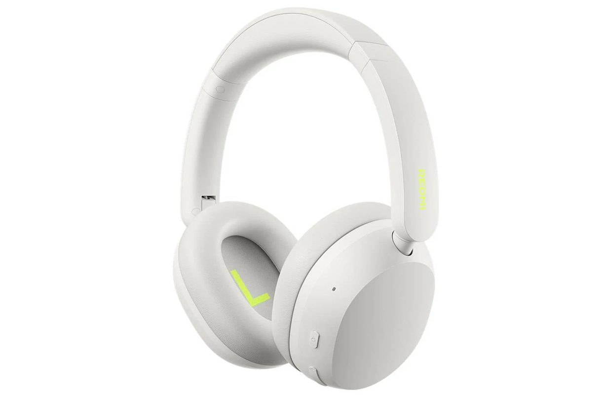 White over-ear headphones with neon yellow accents, shown from the side.