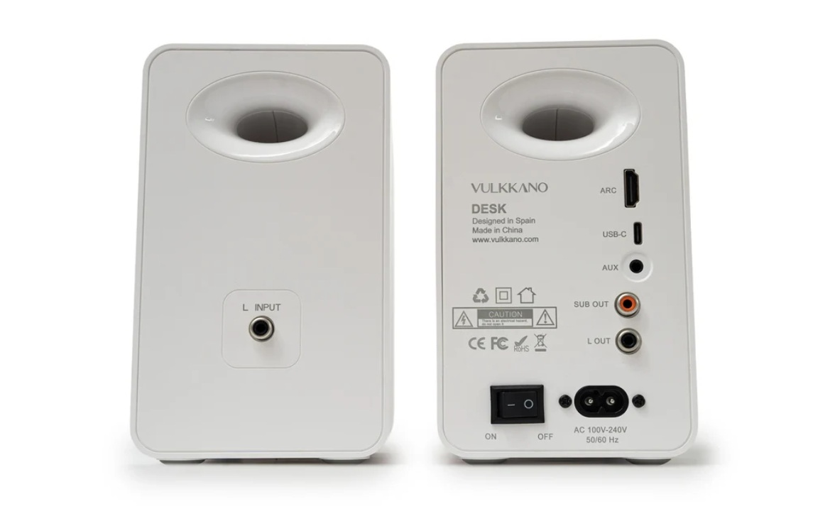 White VULKKANO Desk speakers; back view shows input jack on left unit and ARC, USB-C, AUX, Sub Out, L Out, and power switch on the right unit.